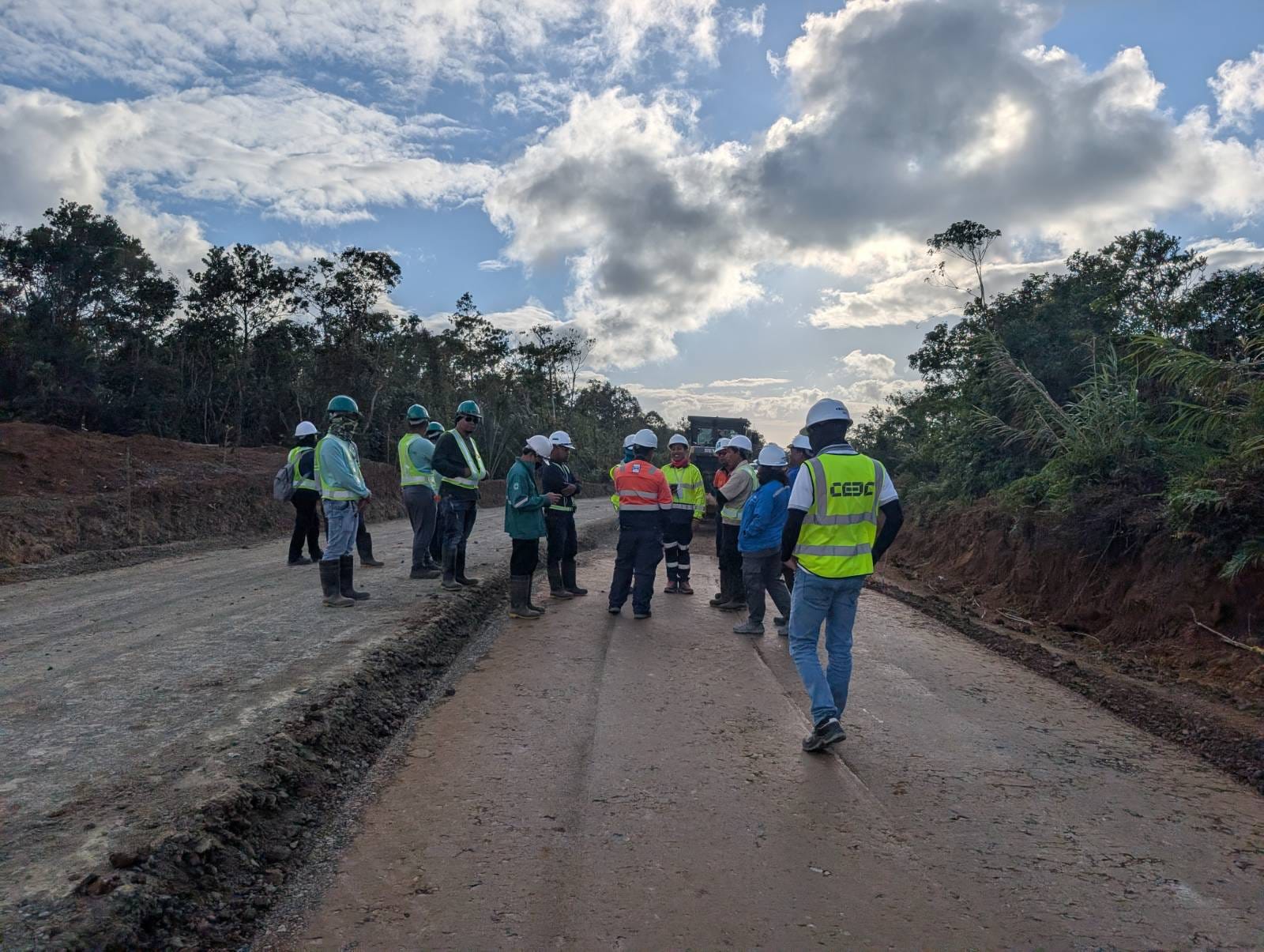 Engineering team reviewing stabilized road project