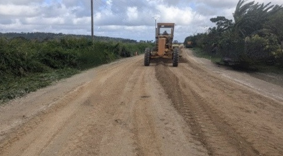 Road roller compacting freshly stabilized base course